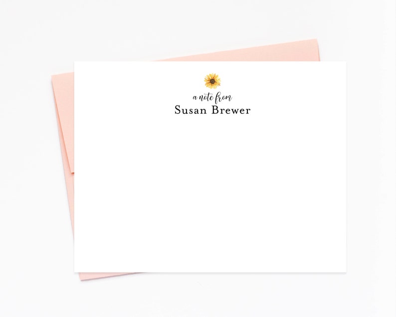 a note card with a sunflower on it