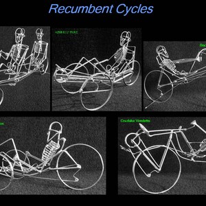 May include: A collection of five different recumbent bicycles, each with a skeletal rider, displayed against a black background. The bicycles are labeled with their names: ATP Double Vision, AZUR ECO TUKI, Cruzbike Vendetts, Cntake Expedition, and Bacchetta Corsa High Racer.