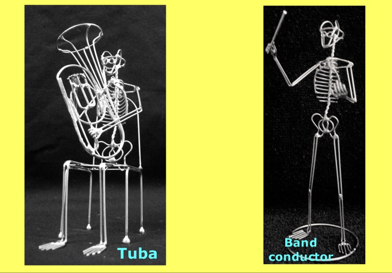 May include: Two wire sculptures of skeletons, one playing a tuba and the other conducting. The sculptures are made of thin wire and are posed in a realistic manner. The tuba player is sitting on a chair and the conductor is standing with a baton raised in the air. The sculptures are both black and white.