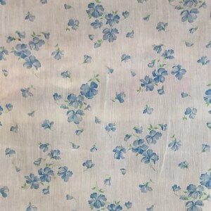 Fine muslin curtain with charming blue  scattered floral print circa 1940