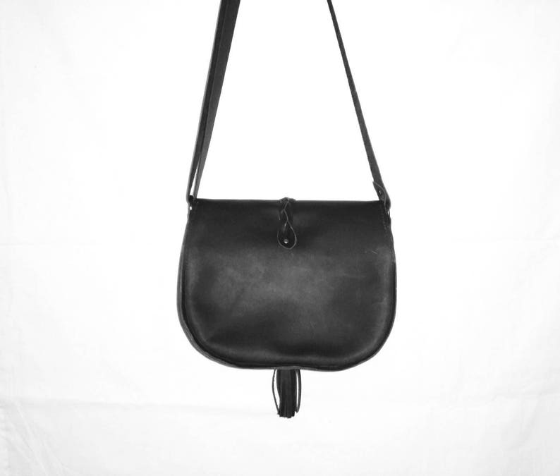 Brown suede crossbody bag with braid and tassel
