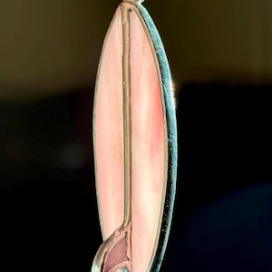 May include: A distressed wooden sign, reading "Welcome to our home" in white lettering. The sign has a rustic finish, ideal for adding a welcoming touch to any home's entrance.