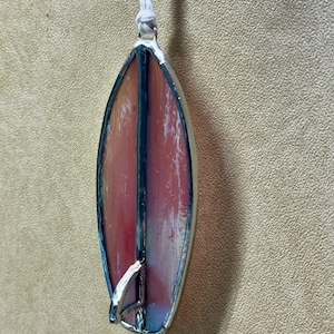 May include: A distressed wooden sign, reading "Welcome to our home" in white lettering. The sign has a rustic finish, ideal for adding a welcoming touch to any home's entrance.