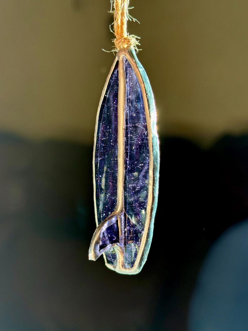 May include: A trio of ceramic mugs with a speckled, matte finish in cream, light grey, and dark grey. Each mug features a simple, minimalist design, ideal for tea or coffee.