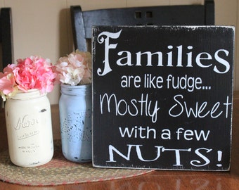 Families are like fudge, mostly sweet with a few nuts wood sign