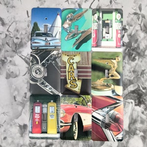 May include: Set of eight vintage-style light switch covers featuring classic car and gas station imagery. The covers feature a variety of designs, including a red and yellow gas pump, a blue car with a white roof, a red car with chrome accents, and a vintage sign that reads "CARS".