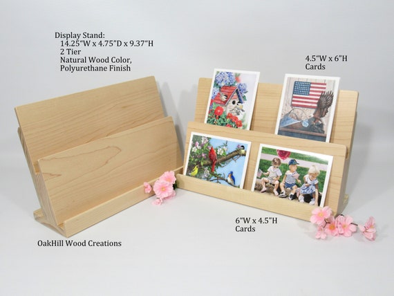 greeting card display cases 3 Tier Black Acrylic Stand Greeting Card Organizer Postcard Display Rack Sticker Display Stand Card Display Shelf Retail Display Stand for Craft Show Vendors Event Counter Table (black) users can also attach the 10 sign holder that simply inserts into the top slot 4 Pcs Greeting Card Display