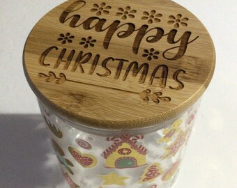 Tarro de cristal con temática navideña grabado con láser con la frase "Feliz Navidad" en la tapa de madera