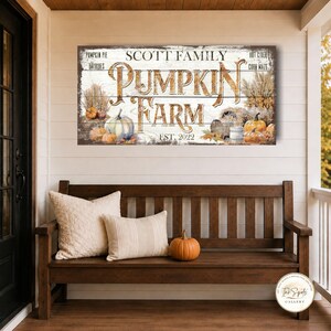May include: A rectangular wooden sign with a white distressed finish featuring the text SCOTT FAMILY PUMPKIN FARM EST. 2022. The design includes illustrations of pumpkins, dried wheat, and text reading PUMPKIN PIE, HAYRIDES, HOT CIDER, and CORN MAZE.