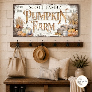 May include: A rectangular wooden sign with a white-washed finish featuring the text SCOTT FAMILY PUMPKIN FARM EST. 2022. The design includes illustrations of pumpkins, dried wheat, and text reading PUMPKIN PIE, HAYRIDES, HOT CIDER, and CORN MAZE.