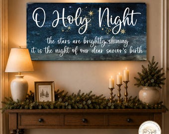 May include: A rectangular wall art piece featuring a dark blue starry night sky background with gold star accents. The text reads O Holy Night, the stars are brightly shining, it is the night of our dear savior's birth in white script.