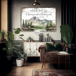 May include: A watercolor painting of a forest scene with mountains in the background. The text "and into the forest I go. To lose my mind and find my soul" is written on a wooden sign with the name "JOHN MUIR" below it.