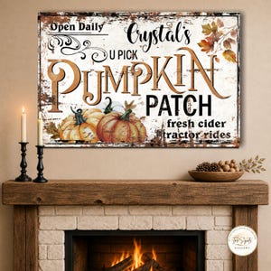 May include: A rectangular wall sign with a distressed white background featuring the text Crystal's U PICK PUMPKIN PATCH, Open Daily, fresh cider, and tractor rides. The design includes illustrations of orange pumpkins and autumn leaves.