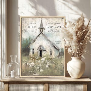 May include: A framed print featuring a watercolor painting of a white church with a steeple, surrounded by greenery and white flowers. The text reads "For where gather there am I" and "two or three in my name with them" with Matthew 18:20 below.