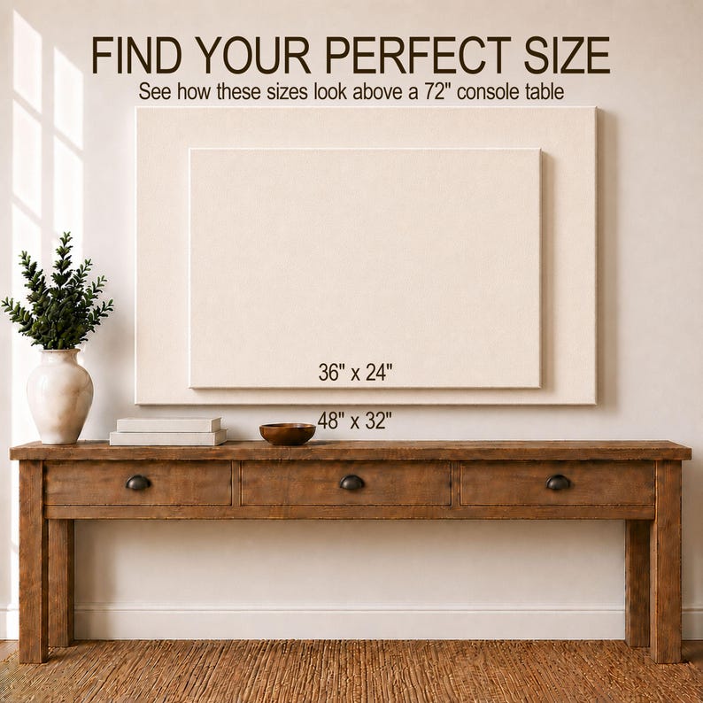 May include: A rectangular wooden console table with three drawers, positioned below two stacked rectangular canvas frames. The text reads: FIND YOUR PERFECT SIZE, See how these sizes look above a 72" console table, 36" x 24", and 48" x 32".