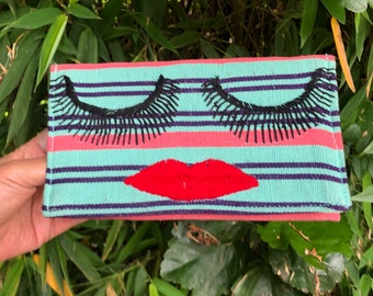 Sassy lipstick lady handwoven and hand-embroidered clutch/wallet in pink, purple, and mint stripes
