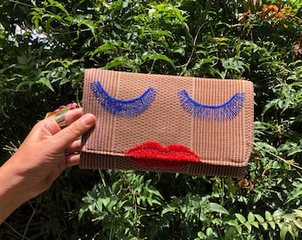 Sassy lipstick lady handwoven and hand-embroidered clutch/wallet in coffee tones