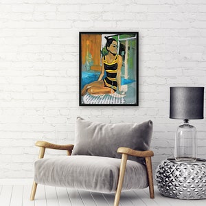 May include: A painting of a woman in a yellow and black swimsuit sitting by a pool. She is holding a glass of wine and looking out the window. The painting is framed in black.