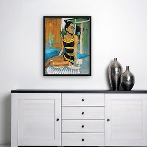May include: A painting of a woman in a black and yellow swimsuit sitting on a patterned towel by a pool. The woman has dark hair and is looking to the right. The background is a blurred image of a building and trees.
