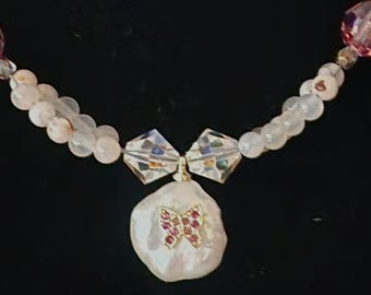 Delicate and gorgeous pearl and rhinestone pendant with crystal and agate beads and sterling silver extender chain and clasp.