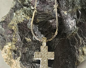 Gorgeous three-dimenional pave-set rhinestone cross on silver-tone chain.