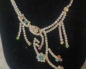 Beautiful vintage rhinestone necklace and earrings set with a modern or art noveau asthetic!