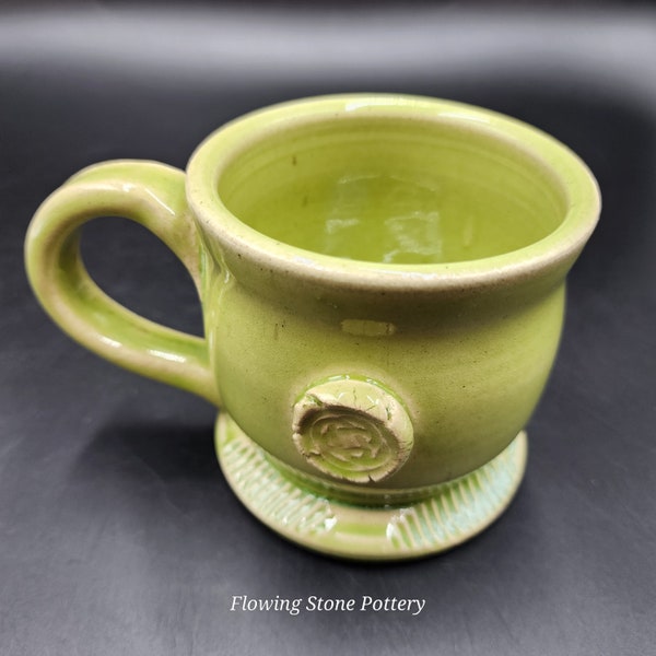 Unique Handmade Pottery Coffee Mug with Celtic knot emblem on side of mug. Artists signature/mark on bottom! Microwave & Dishwasher Safe.