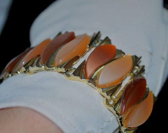 Midcentury Lucite bracelet set in gold tone metal. Two tone 1960's bracelet. Perfect fall colors.