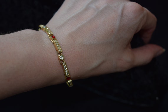 Rhinestone bracelet with red accents gold tone li… - image 3