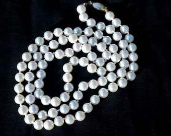 Glass pearls. Long creamy glass pearls over the head style. Stunning vintage pearls.
