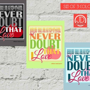 May include: Three framed art prints with the quote "Never Doubt That Love" in different color schemes. The prints feature the quote by William Shakespeare, with a heart graphic. The background is a white brick wall.