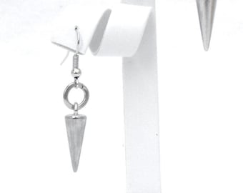 May include: Silver-toned earrings with a conical, spiked design. Each earring features a small, round ring connecting the spike to a curved ear wire. The earrings are displayed on a white stand against a white background.
