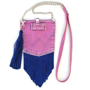 A pink denim and blue suede cross-body mini-pouch ... small in size, big on style! 

The 47 inch strap is a combination of comfortable denim and stylish chain, putting the bag at an accessible length.