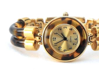 Avon fashion watch: Vintage faux-tortoise shell lucite accents, quartz mvmt. working keeps time