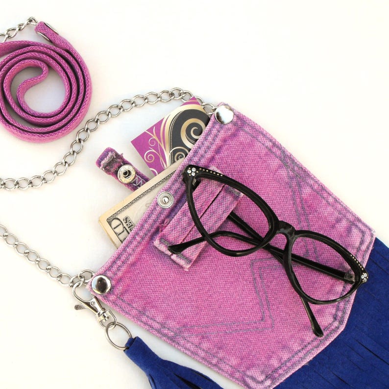 Reclaimed belt loops have been added to the handmade mini-purse for attitude (and a little extra function!)  Seen here with a pair of glasses hooked onto the decorativ belt loop.