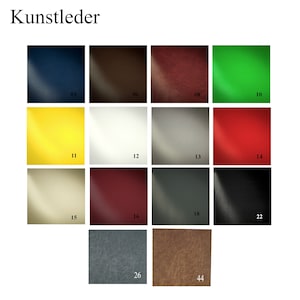 May include: A color chart of Kunstleder, or faux leather, featuring various shades. The chart includes swatches in colors such as navy blue, brown, burgundy, green, yellow, off-white, silver, red, beige, dark red, charcoal, and black. Each swatch is numbered.