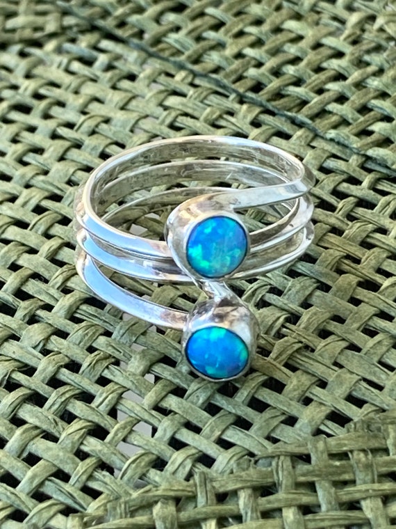 Sterling silver bypass ring with two opals