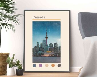 May include: A poster with a cityscape of Toronto, Canada, with the CN Tower in the center. The poster has a light blue background with a yellow stripe at the top and the word "Canada" in black text. The poster also has a row of five color swatches at the bottom.