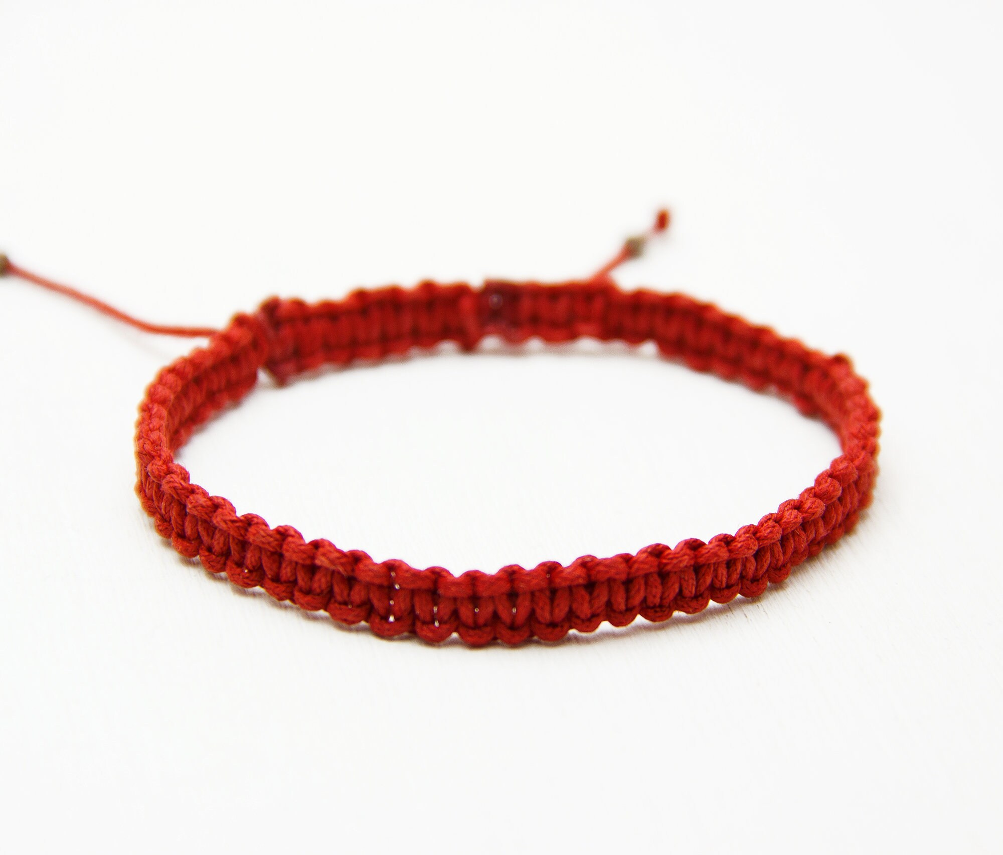 red string to ward off evil