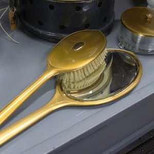 Gold toned Art Deco dressing set | hand mirror, brush and powder jar