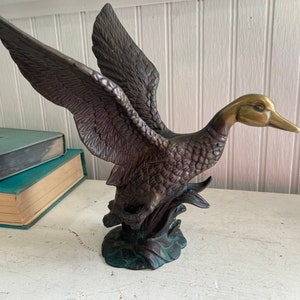 Solid metal duck statue