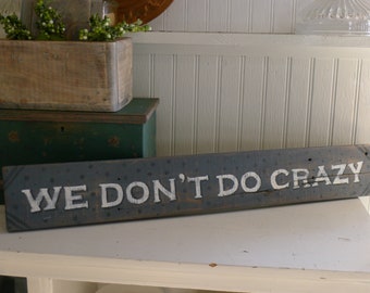 Hand painted wood sign: We Don't Do Crazy