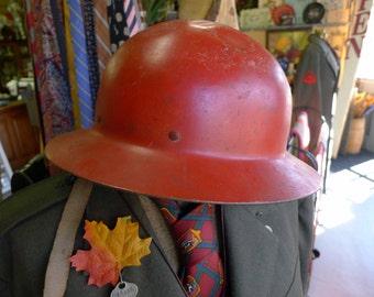 Red metal Civil Defense helmet