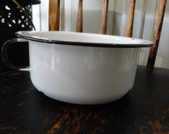 White enamelware handled bowl