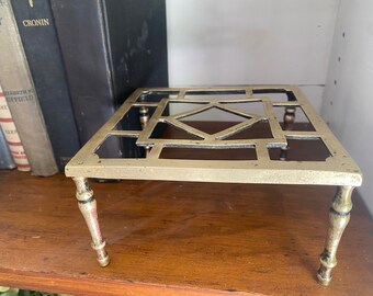 Solid Brass square trivet on four legs