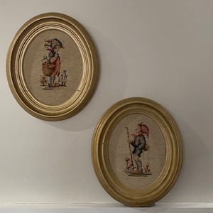 Pair of oval-framed embroidery: boy and girl