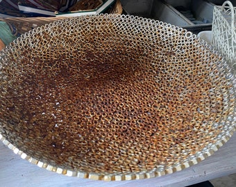 Large metal bowl crafted from welded hardware nuts