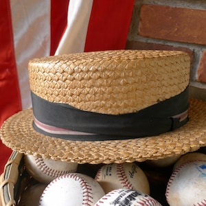 Straw boater hat with striped grosgrain ribbon