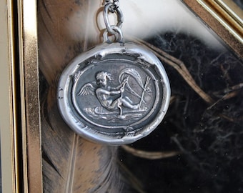 Love findeth the way…… Tassie seal with Cupid and rough seas. Sterling silver antique wax letter seal amulet. Handmade jewelry.