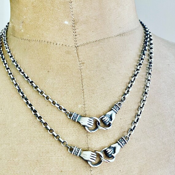 Clasped Hands Necklace. Sterling Silver 